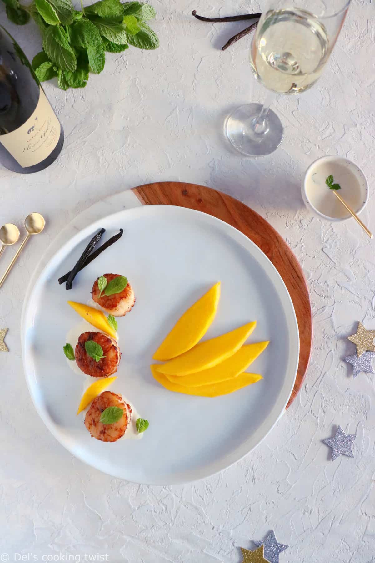 Add an exotic touch to your seafood with these elegant seared scallops with vanilla sauce and fresh mango.