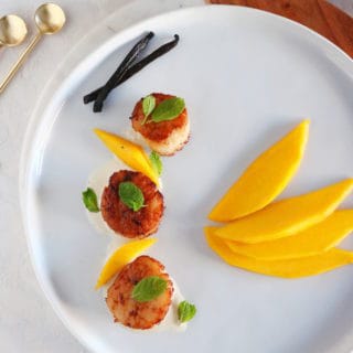 Add an exotic touch to your seafood with these elegant seared scallops with vanilla sauce and fresh mango.