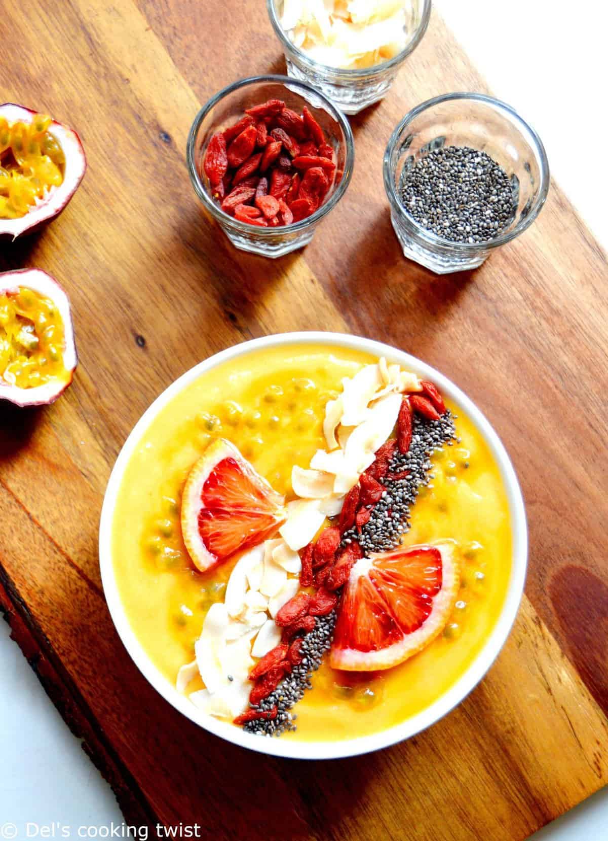 This mango smoothie bowl is colorful, packed with vitamins, and has an irresistible tropical touch. Vegan and healthy, it is garnished with superfood ingredients that will lift up your mood and keep you energized for the day!