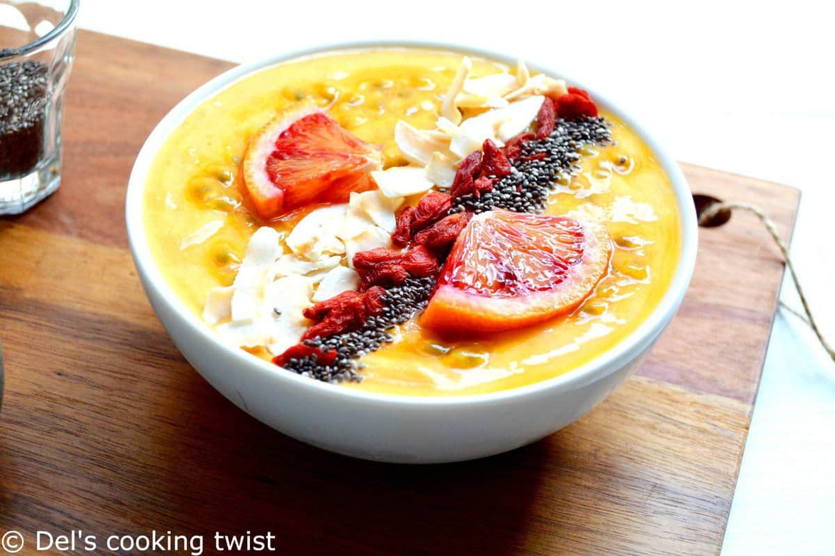 This mango smoothie bowl is colorful, packed with vitamins, and has an irresistible tropical touch. Vegan and healthy, it is garnished with superfood ingredients that will lift up your mood and keep you energized for the day!