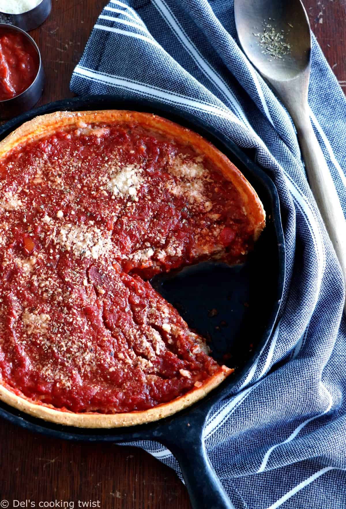 Discover the authentic Chicago-style deep dish pizza, made with a crunchy flaky crust and garnished with thick layers of cheese and tomato sauce.