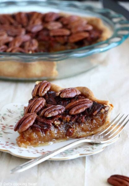 Here's the BEST pecan pie recipe. This old-fashioned dessert features a sweet, gooey center, and crunchy pecans. Perfect for the holidays!