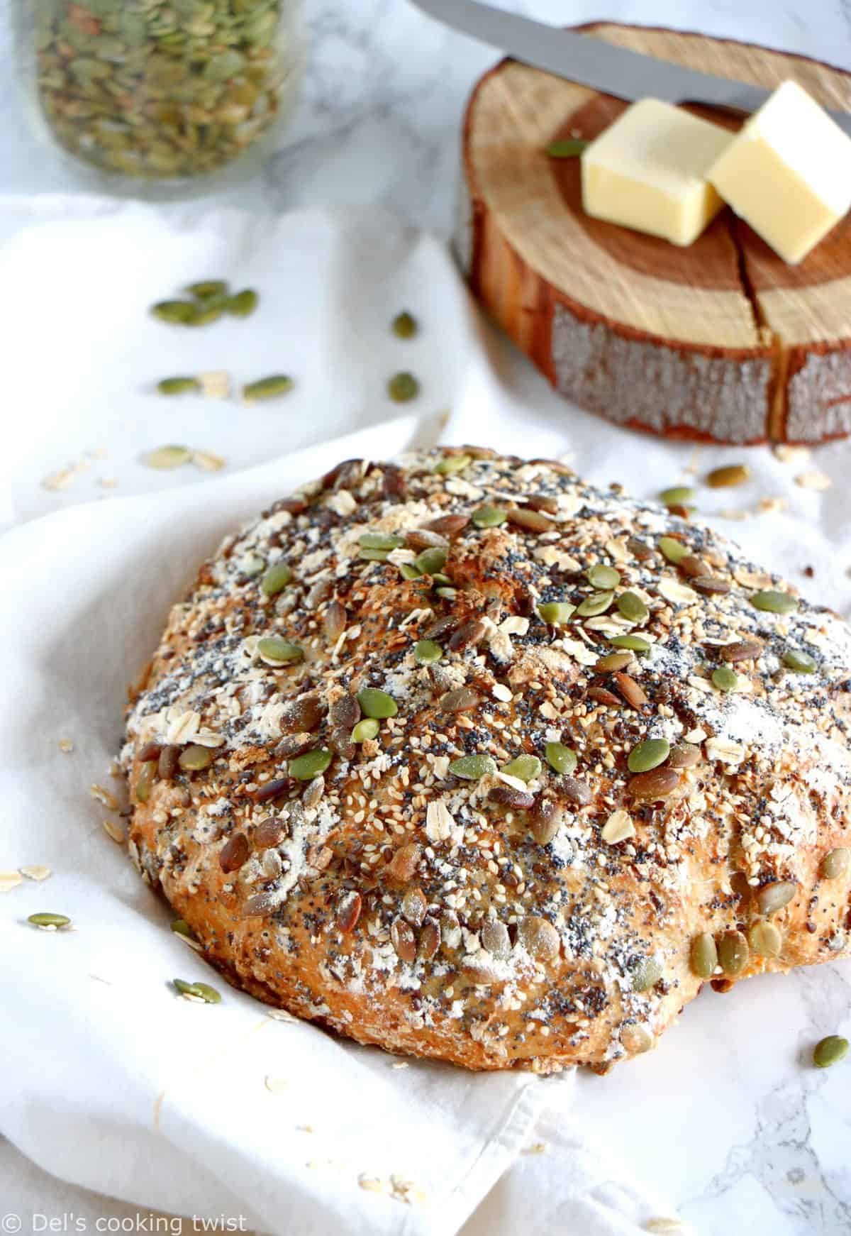 Freshly baked, vegan baguette with sesame seeds, cut on a light