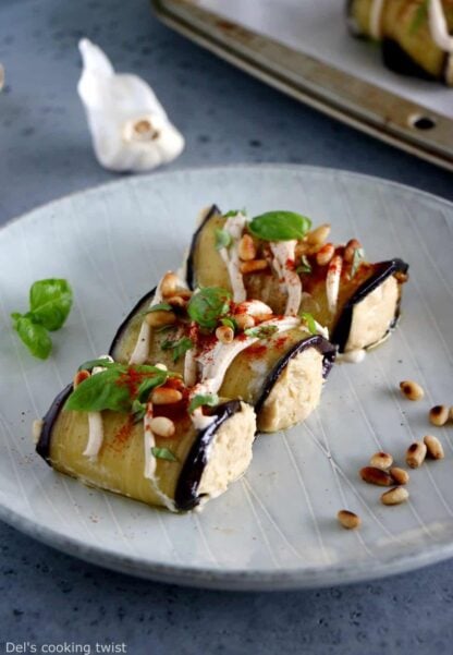 Eggplant rolls filled with a homemade roasted garlic hummus make a fantastic healthy appetizer or snack, that is also vegan and gluten-free.