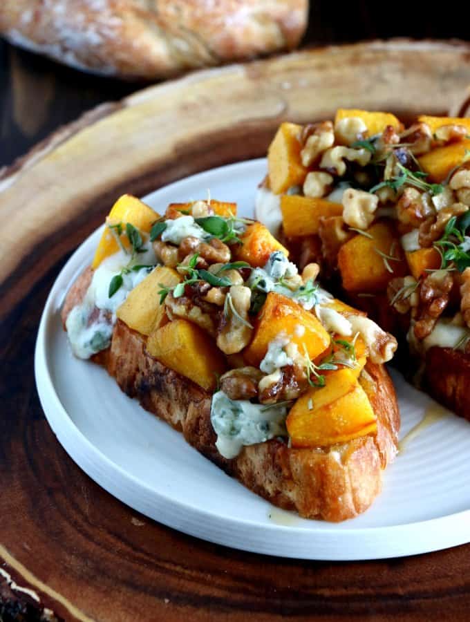 Gather up the bounty of fall with this pumpkin, walnut and blue Cheese bruschetta. This harvest-inspired dish makes a perfect appetizer or side dish to a cozy soup for a lazy weeknight dinner.