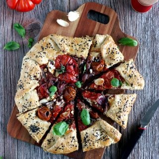 Balsamic Caramelized Onions and Goat Cheese Tomato Galette. This tomato galette is prepared with balsamic caramelized onions, heirloom tomatoes and fresh goat cheese, all tucked into a flaky pie crust. It makes a great end of summer light dinner, appetizer or brunch item.