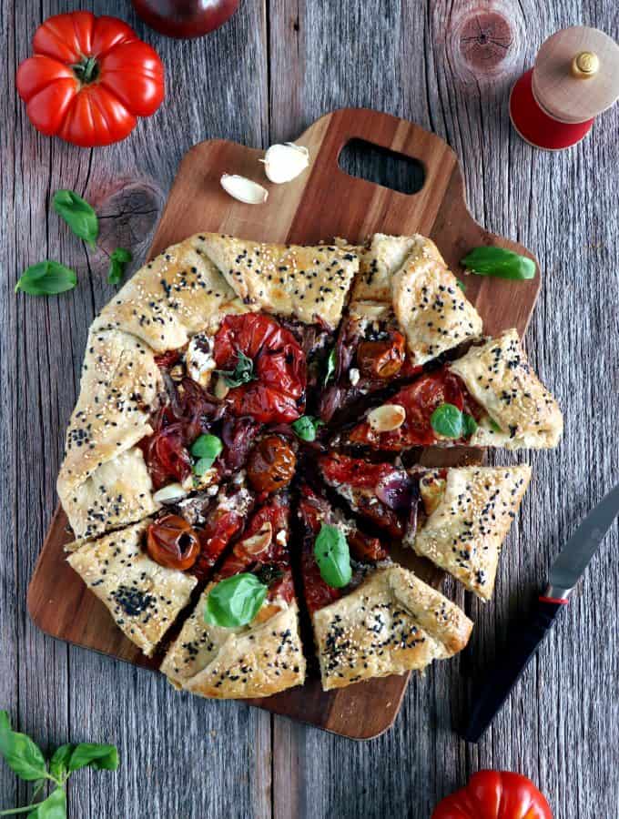 Balsamic Caramelized Onions and Goat Cheese Tomato Galette. This tomato galette is prepared with balsamic caramelized onions, heirloom tomatoes and fresh goat cheese, all tucked into a flaky pie crust. It makes a great end of summer light dinner, appetizer or brunch item.