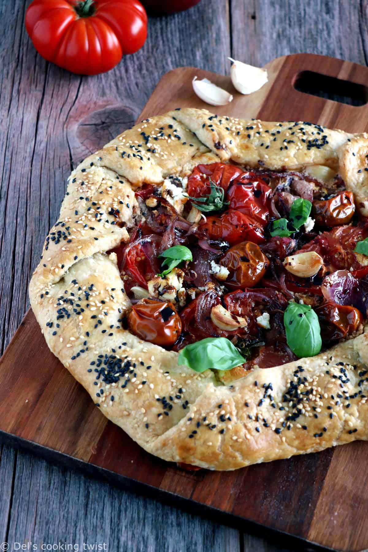 Balsamic Caramelized Onions and Goat Cheese Tomato Galette. This tomato galette is prepared with balsamic caramelized onions, heirloom tomatoes and fresh goat cheese, all tucked into a flaky pie crust. It makes a great end of summer light dinner, appetizer or brunch item.