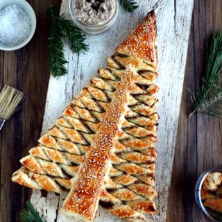 Puff pastry Christmas tree is a festive holiday appetizer with pull-apart breadsticks filled with savory toppings of your choice. Easy to make and delicious, it is sure to impress at your next Christmas party!