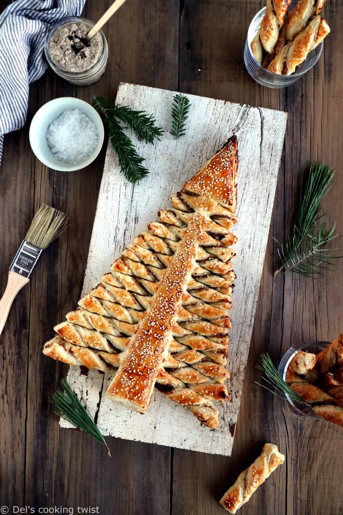 Puff pastry Christmas tree is a festive holiday appetizer with pull-apart breadsticks filled with savory toppings of your choice. Easy to make and delicious, it is sure to impress at your next Christmas party!