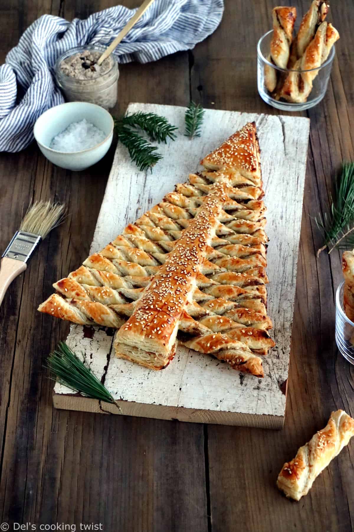 Puff pastry Christmas tree is a festive holiday appetizer with pull-apart breadsticks filled with savory toppings of your choice. Easy to make and delicious, it is sure to impress at your next Christmas party!