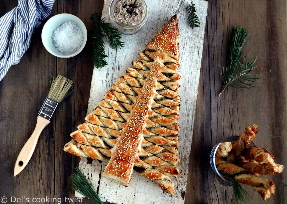Puff pastry Christmas tree is a festive holiday appetizer with pull-apart breadsticks filled with savory toppings of your choice. Easy to make and delicious, it is sure to impress at your next Christmas party!