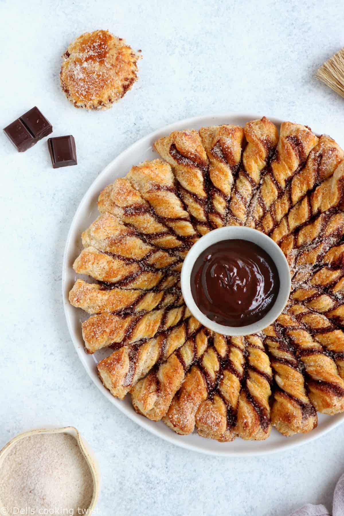 For a quick party dessert in a pinch, this churro-style cinnamon sugar tarte soleil with a chocolate dipping sauce is the answer.