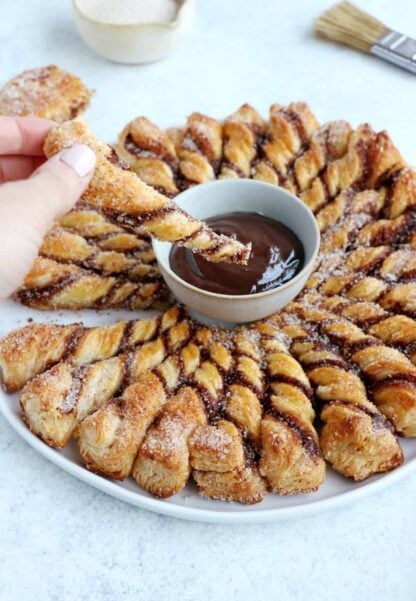 For a quick party dessert in a pinch, this churro-style cinnamon sugar tarte soleil with a chocolate dipping sauce is the answer.