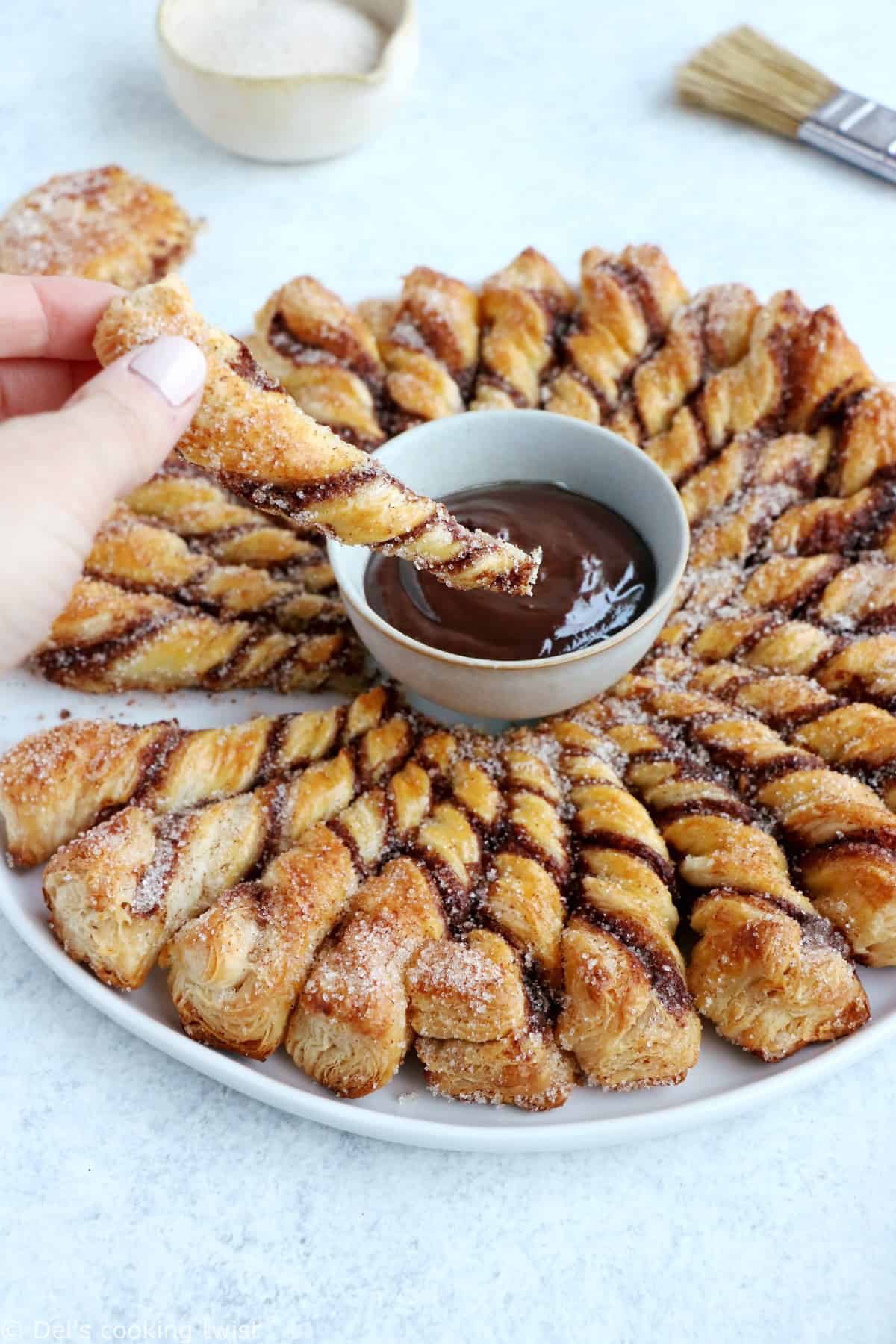 For a quick party dessert in a pinch, this churro-style cinnamon sugar tarte soleil with a chocolate dipping sauce is the answer.