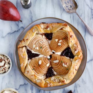 This rustic but elegant pear and chocolate ricotta galette comes in a folded-over flaky pie crust and makes for a lovely fruit dessert for lazy days.