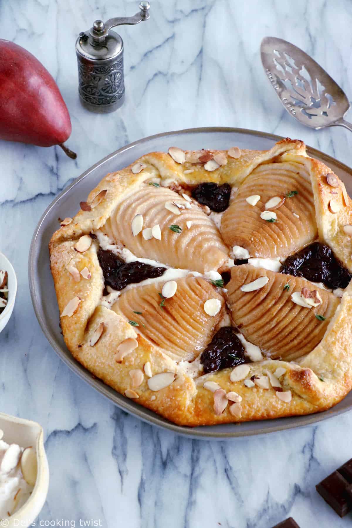 This rustic but elegant pear and chocolate ricotta galette comes in a folded-over flaky pie crust and makes for a lovely fruit dessert for lazy days.