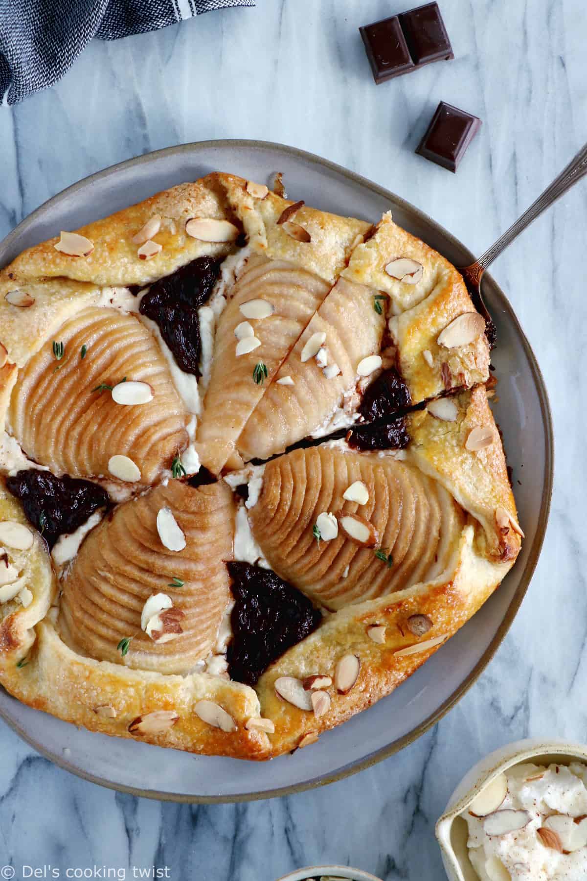 This rustic but elegant pear and chocolate ricotta galette comes in a folded-over flaky pie crust and makes for a lovely fruit dessert for lazy days.