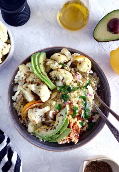 This quick and easy cumin-roasted cauliflower tabbouleh salad is game-changing. It's a super healthy vegan salad recipe, packed with delicious roasted veggies, fresh herbs, and loaded with plant-based protein.