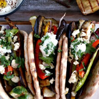 These Grilled Veggie Gyros with Feta-Yogurt Dip are a quick vegetarian version of the popular Greek sandwich made with pita bread.