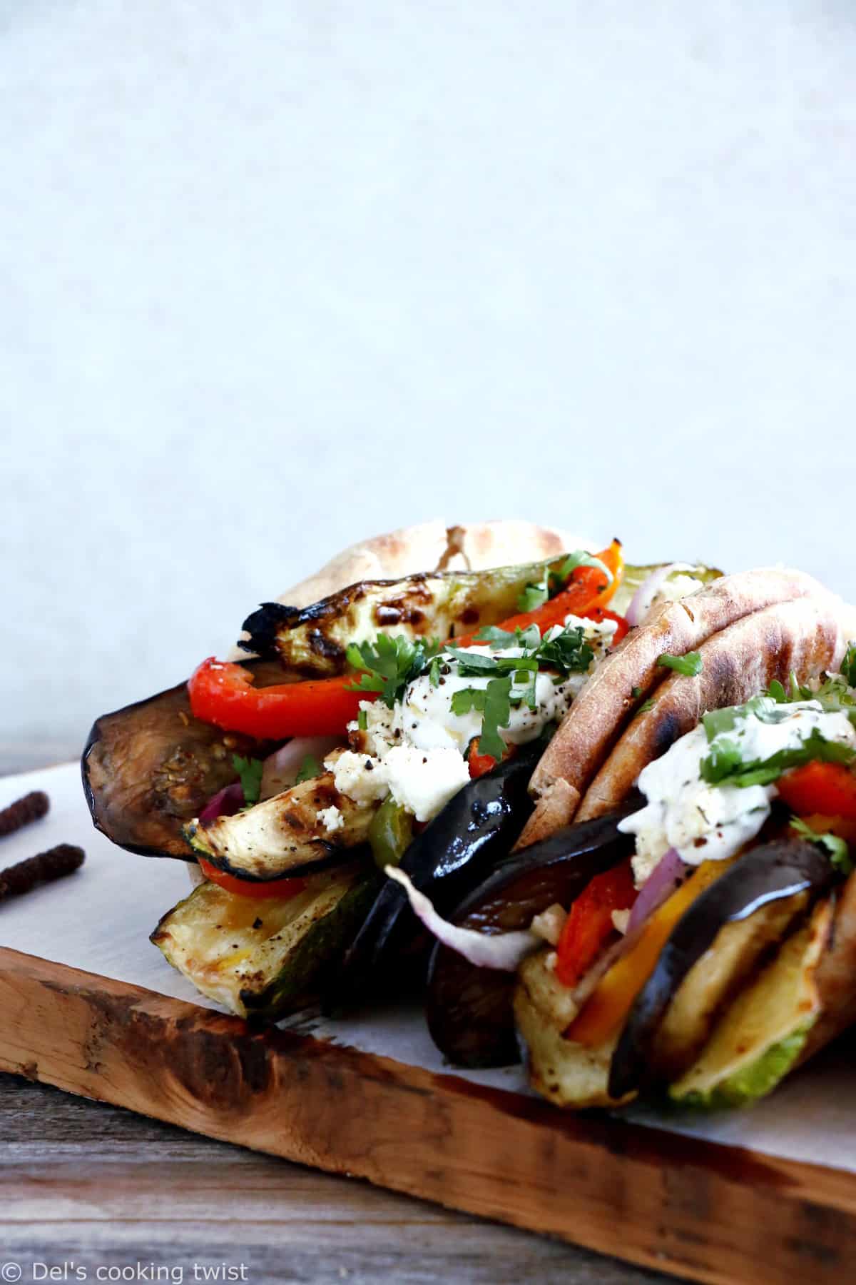 These Grilled Veggie Gyros with Feta-Yogurt Dip are a quick vegetarian version of the popular Greek sandwich made with pita bread.