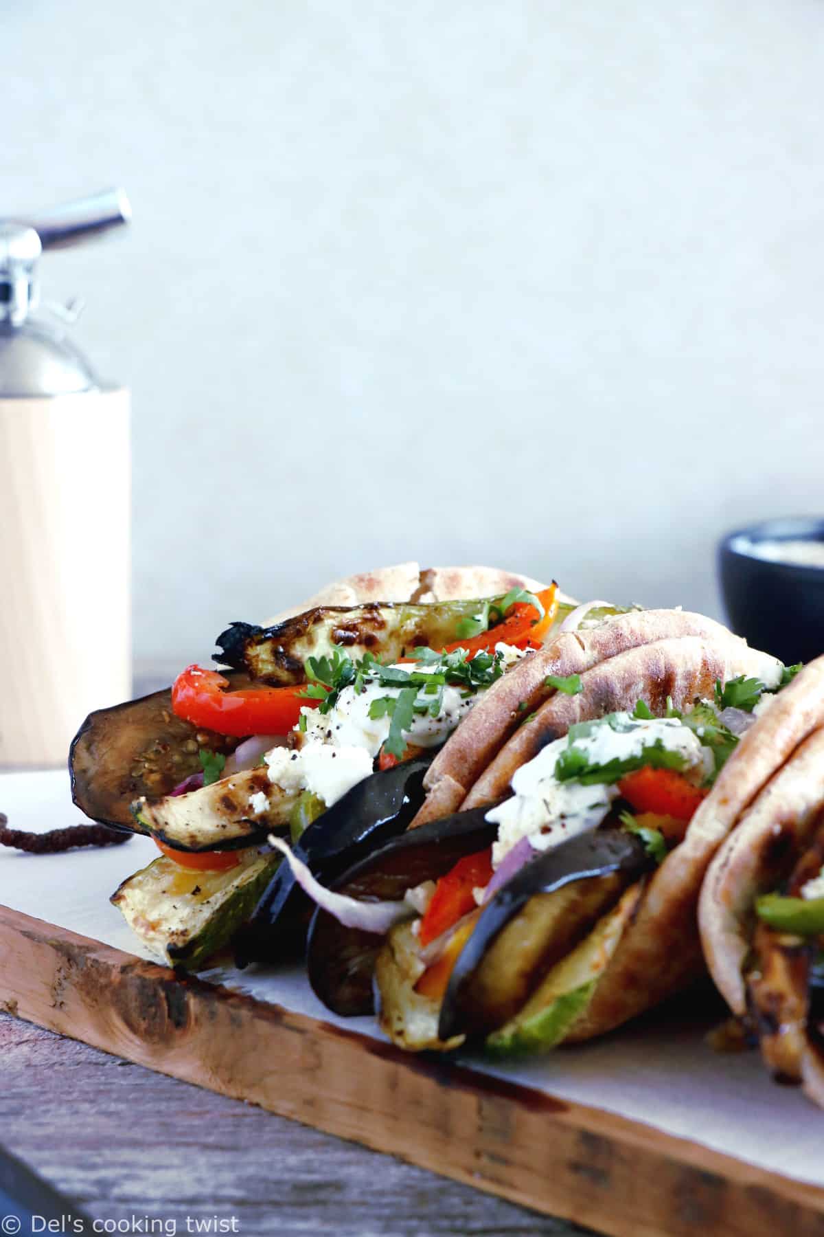 These Grilled Veggie Gyros with Feta-Yogurt Dip are a quick vegetarian version of the popular Greek sandwich made with pita bread.
