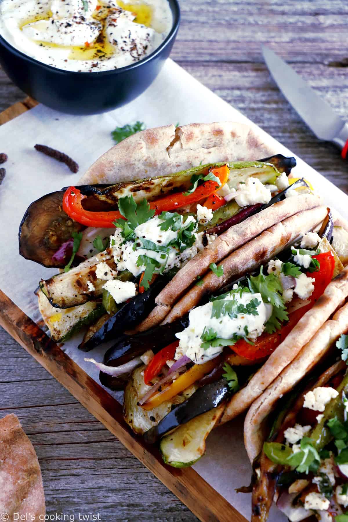 These Grilled Veggie Gyros with Feta-Yogurt Dip are a quick vegetarian version of the popular Greek sandwich made with pita bread.