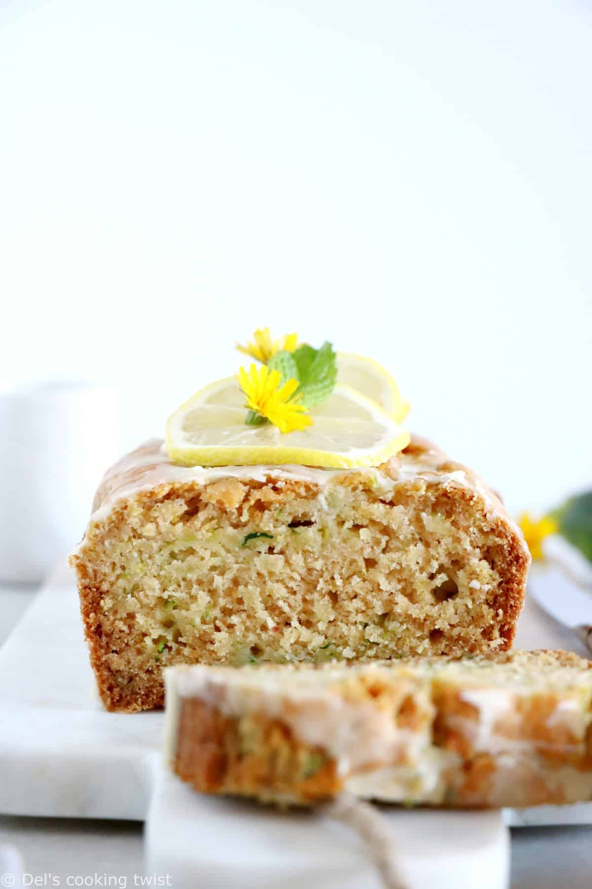 This healthy vegan lemon zucchini bread is light, fluffy and perfectly tender, with a subtle lemon glaze.