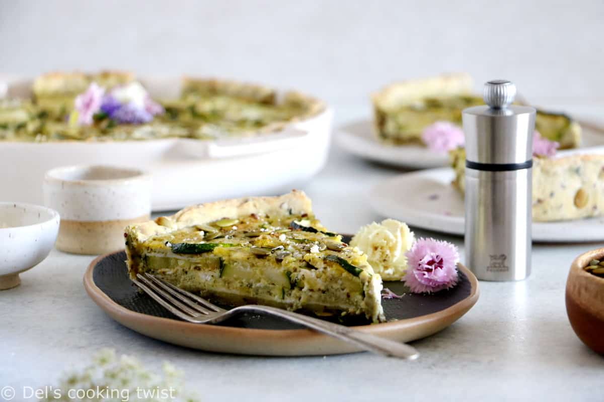 This delicious zucchini quiche features fresh goat cheese, pesto, and a subtle pie crust with seeds.