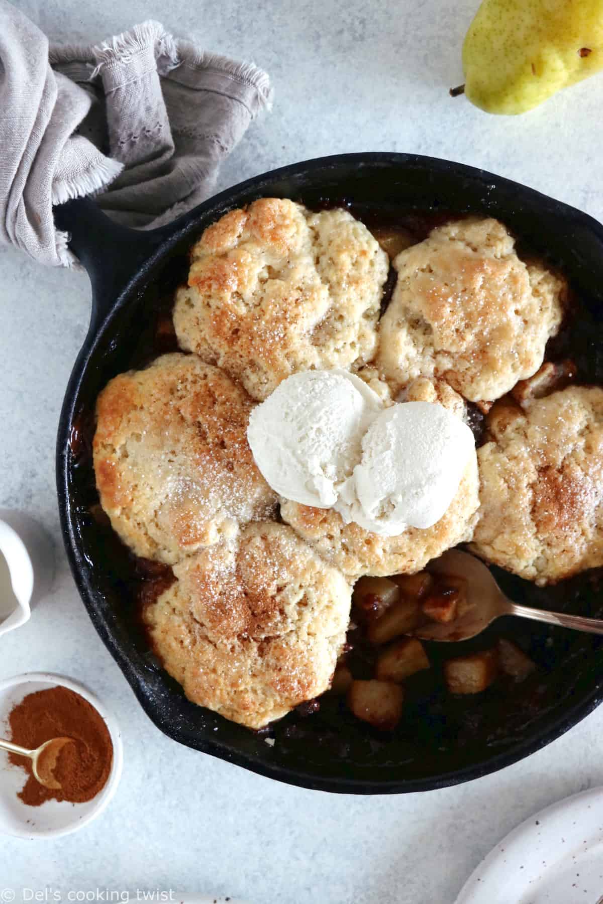 Spiced Chocolate Pear Cobbler is a beautiful dessert featuring dropped biscuit and seasonal fruits coated with a mix of warm Autumn spices and dark chocolate.