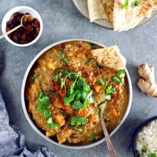 This Vegan Indian Mango Butternut Squash Curry features a creamy mango curry sauce, diced butternut squash, all wrapped in some delicious warm spices.