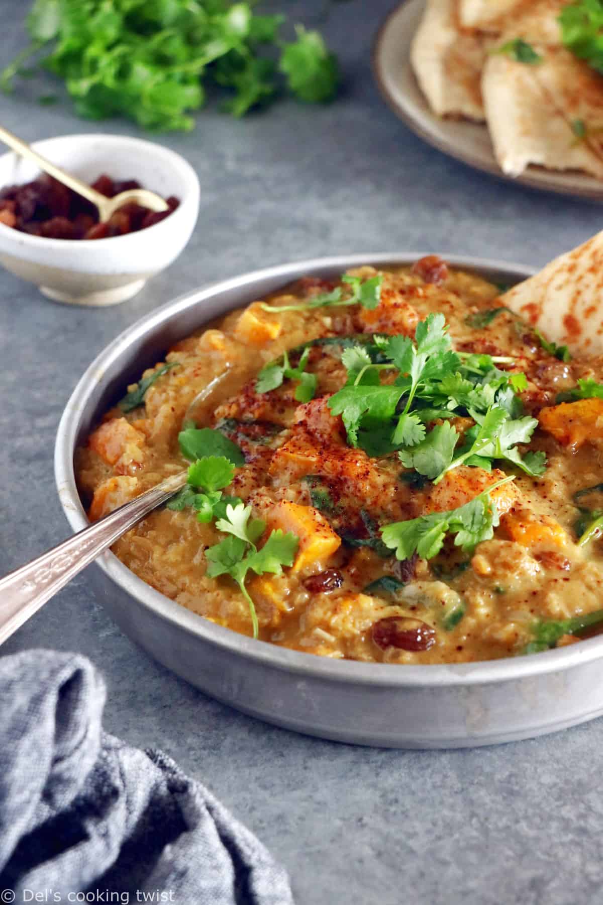 This Vegan Indian Mango Butternut Squash Curry features a creamy mango curry sauce, diced butternut squash, all wrapped in some delicious warm spices.