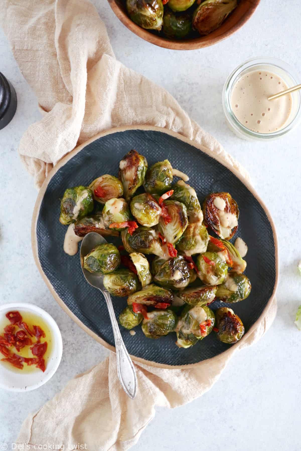 Soy roasted Brussels sprouts with cashew sauce are crispy, tender, with a subtle Asian touch.