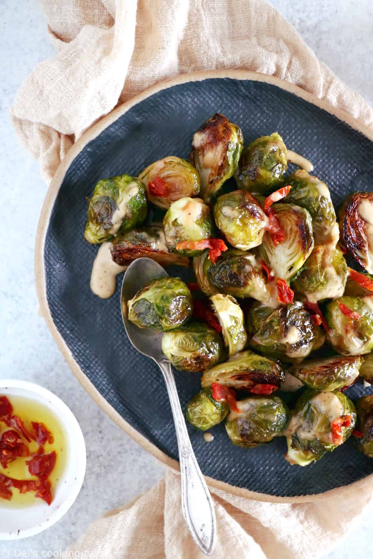 Soy roasted Brussels sprouts with cashew sauce are crispy, tender, with a subtle Asian touch.