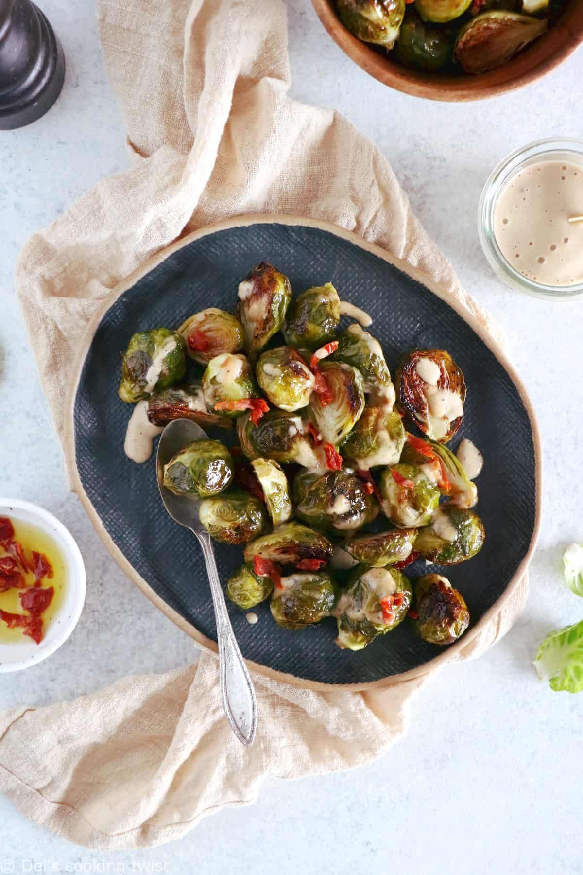 Soy roasted Brussels sprouts with cashew sauce are crispy, tender, with a subtle Asian touch.