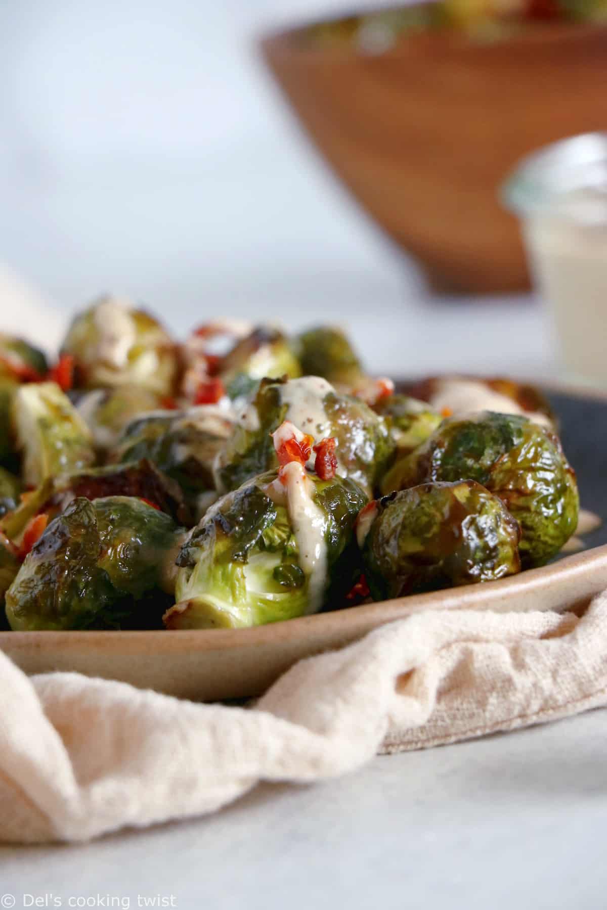 Soy roasted Brussels sprouts with cashew sauce are crispy, tender, with a subtle Asian touch.