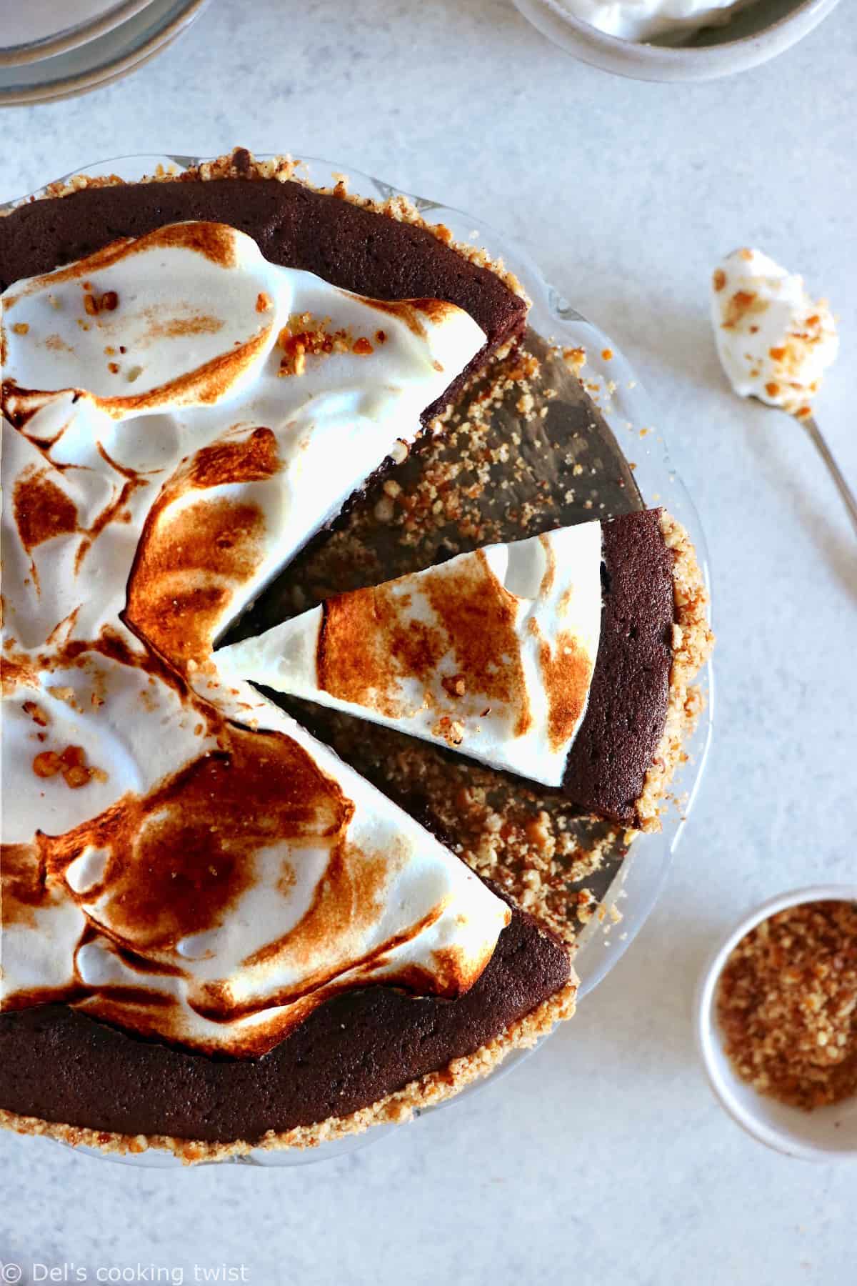 This Chocolate Brownie Meringue Pie with Pretzel Crust sits in a crunchy salty bottom crust, a rich and fudgy chocolate brownie layer and a homemade Italian meringue on top.