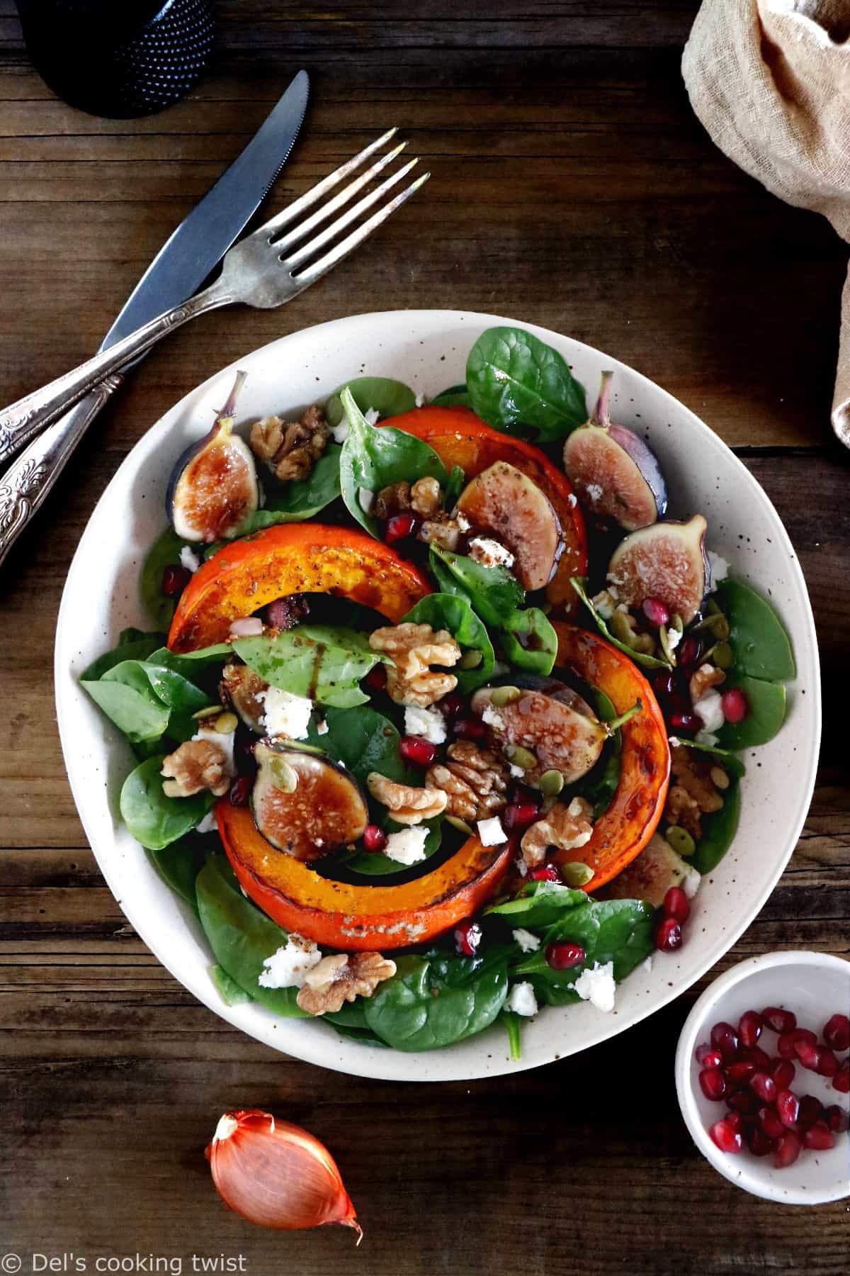 This roasted squash salad features caramelized figs with balsamic vinegar, baby spinach, and a subtle shallot vinaigrette.