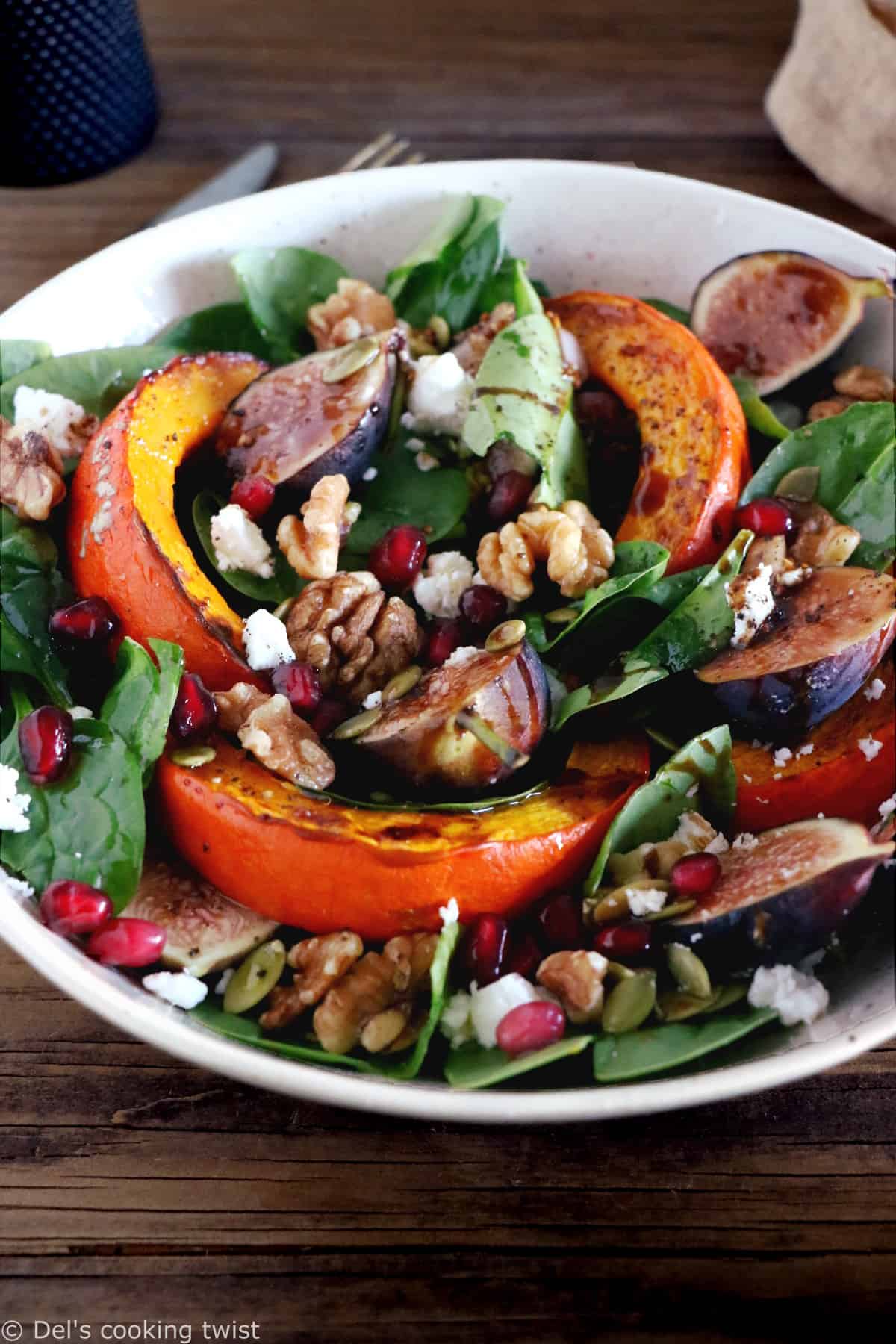 This roasted squash salad features caramelized figs with balsamic vinegar, baby spinach, and a subtle shallot vinaigrette.