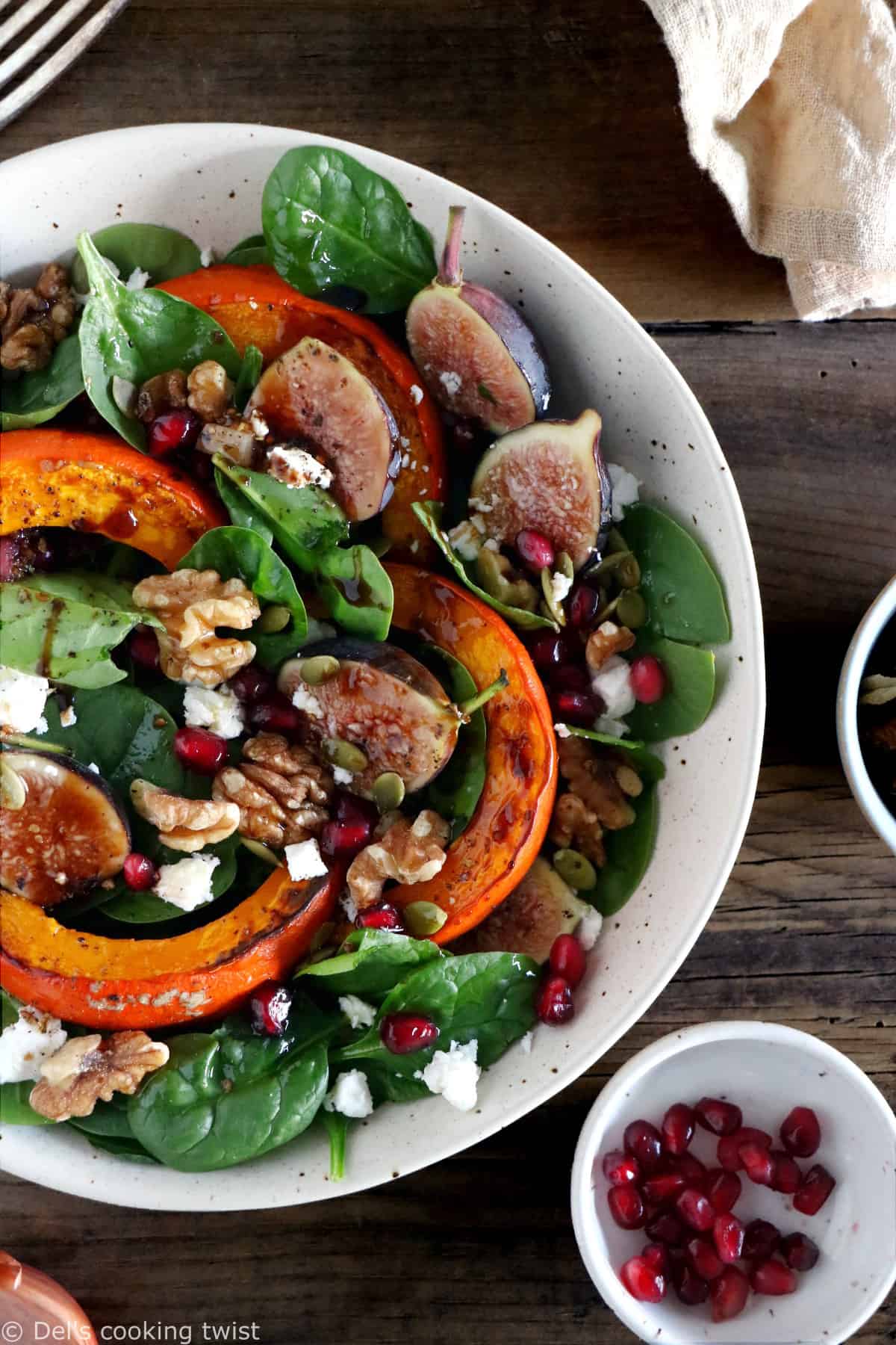 This roasted squash salad features caramelized figs with balsamic vinegar, baby spinach, and a subtle shallot vinaigrette.