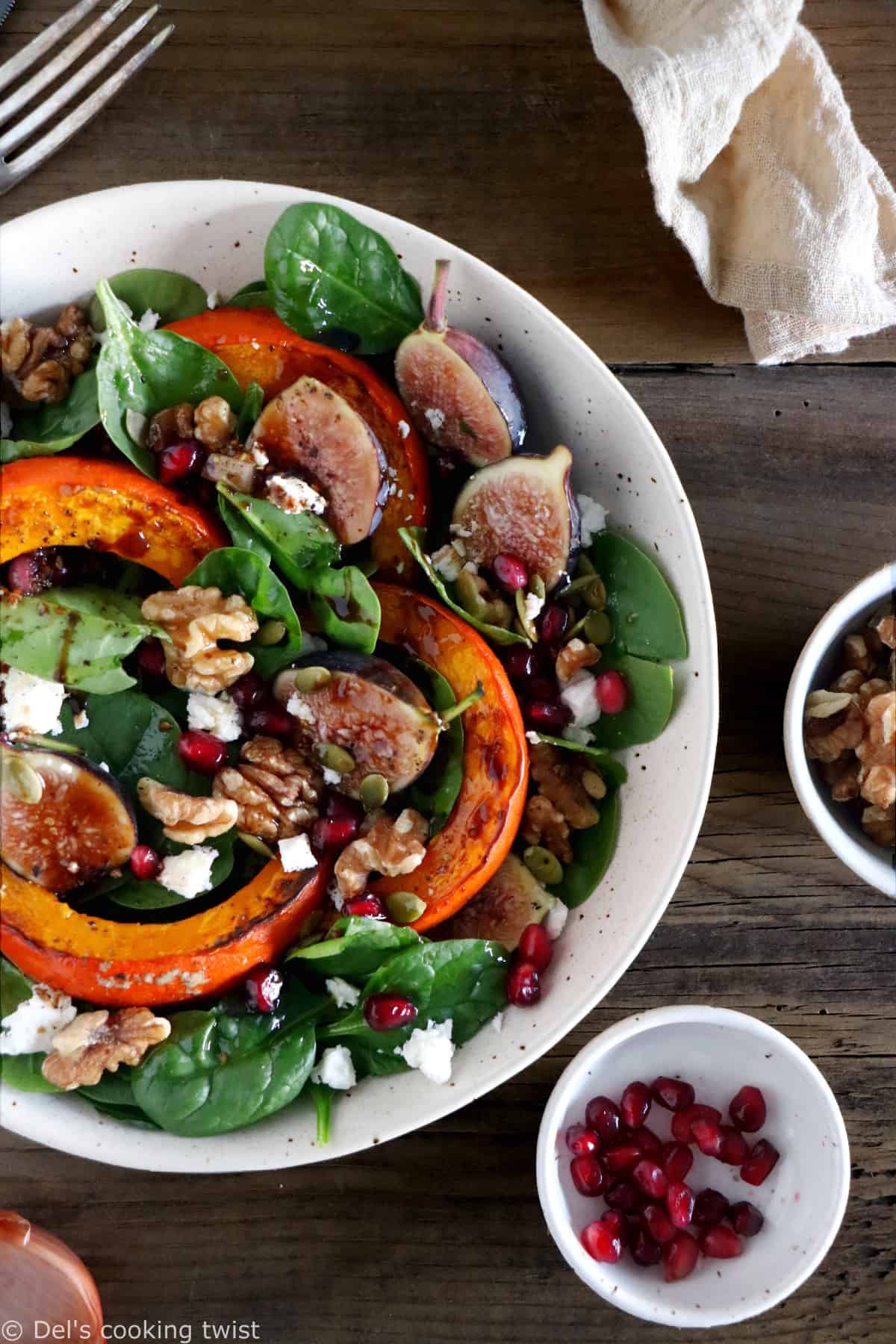 This roasted squash salad features caramelized figs with balsamic vinegar, baby spinach, and a subtle shallot vinaigrette.