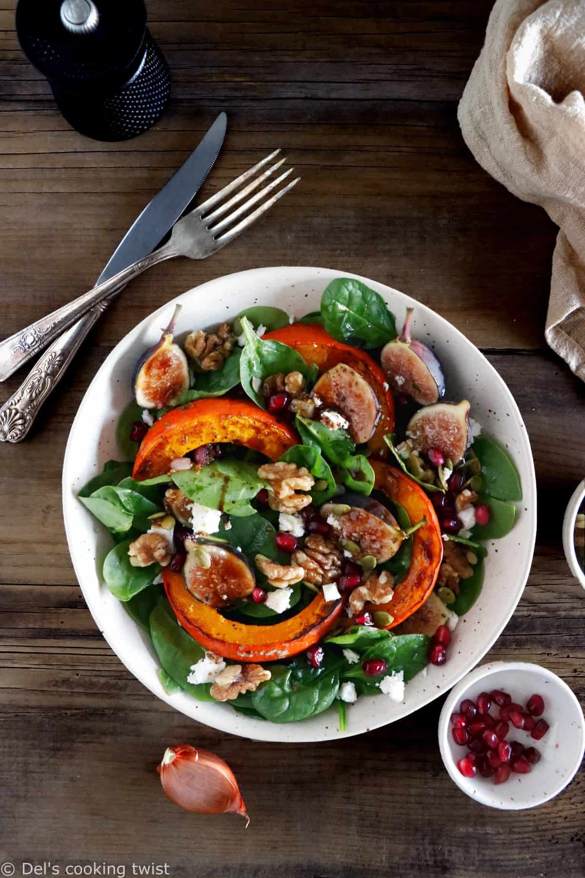 This roasted squash salad features caramelized figs with balsamic vinegar, baby spinach, and a subtle shallot vinaigrette.