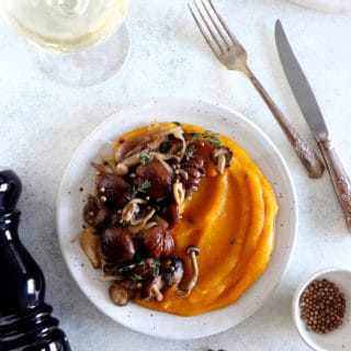 Both festive and hearty, this chestnut and mushroom casserole with allspice butternut squash puree will make an elegant centerpiece on your holiday table.