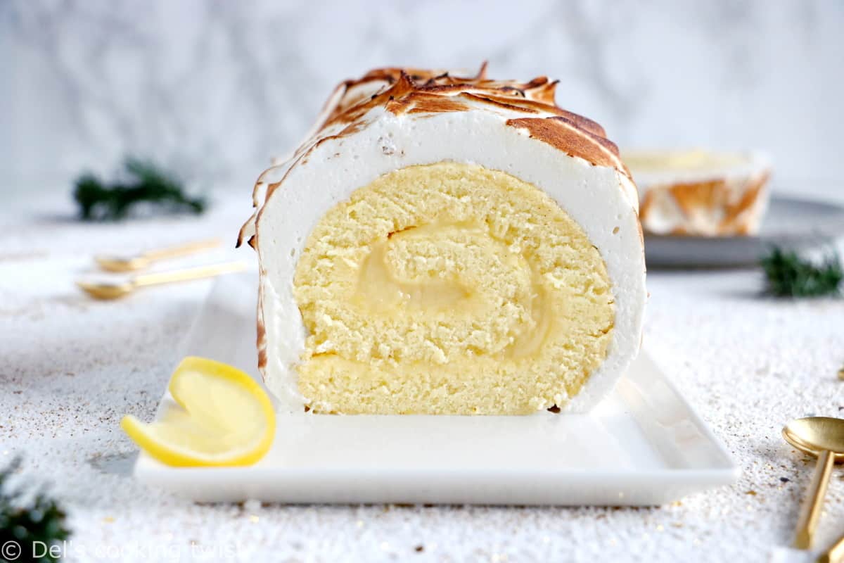 Lemon Meringue Roulade or cake roll consists of a supremely moist sponge cake filled with homemade lemon curd and covered with swirls of torched meringue.