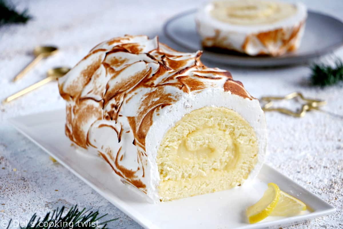 Lemon Meringue Roulade or cake roll consists of a supremely moist sponge cake filled with homemade lemon curd and covered with swirls of torched meringue.