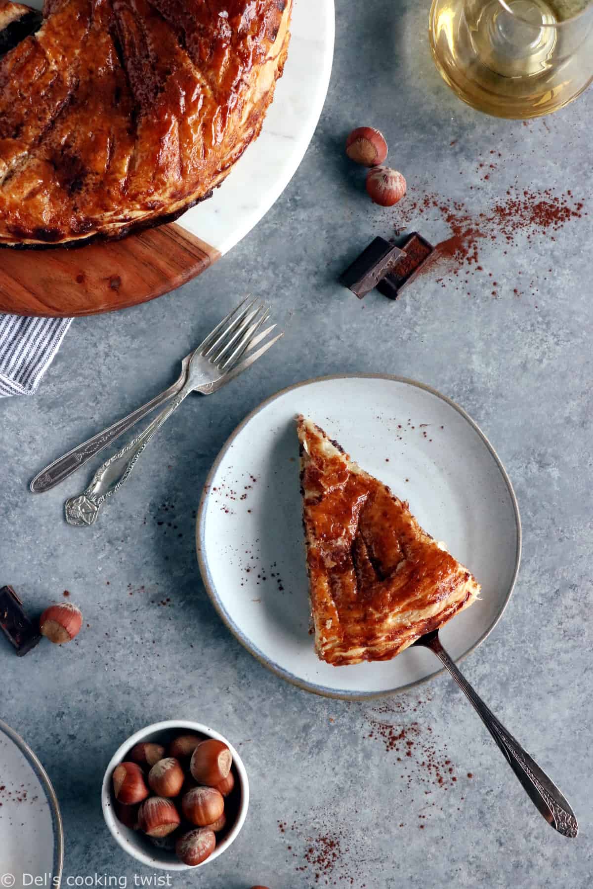 This Hazelnut Chocolate Galette des Rois features a hazelnut frangipane (instead of almond) and some grated dark chocolate, wrapped in between 2 sheets of puff pastry.