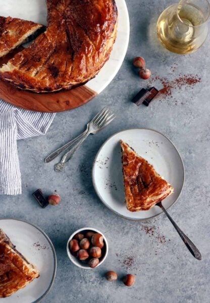 This Hazelnut Chocolate Galette des Rois features a hazelnut frangipane (instead of almond) and some grated dark chocolate, wrapped in between 2 sheets of puff pastry.