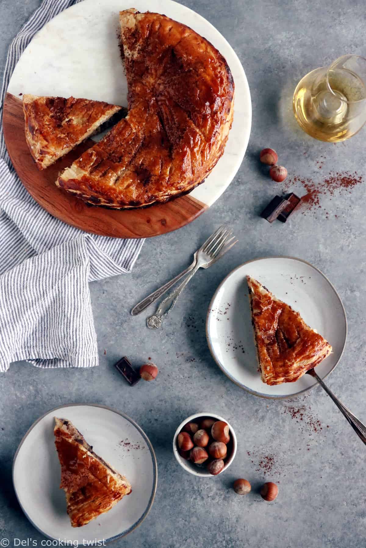 This Hazelnut Chocolate Galette des Rois features a hazelnut frangipane (instead of almond) and some grated dark chocolate, wrapped in between 2 sheets of puff pastry.