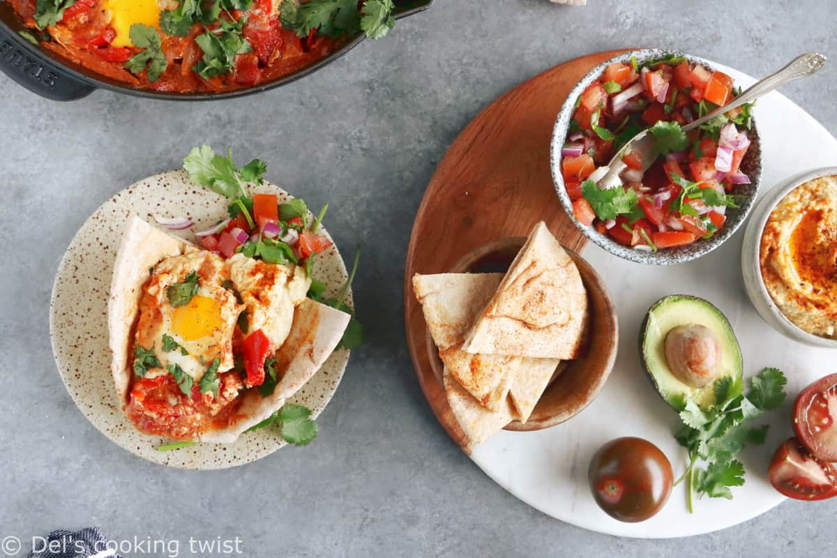 Ever wondered how to serve a shakshuka? Place it in the center of the table and serve with various small plates, breads and salads to make this meal a feast!