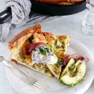 Elevate your brunch game with this savory Dutch baby pancake with herbs and garnished with caramelized onions and fresh burrata. Pour the batter in one skillet, place in the oven and watch it puff here and there!